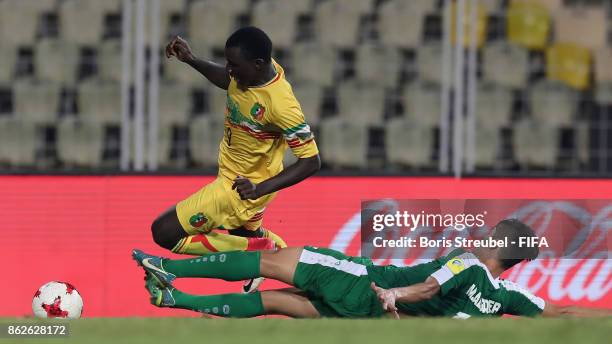 Mohammed Albaqer of Iraq tackles Seme Camara of Mali during the FIFA U-17 World Cup India 2017 Round of 16 match between Mali and Iraq at Pandit...