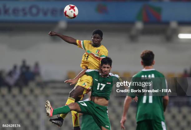 Mohammed Ali of Iraq jumps for a header with Siaka Sidibe of Mali during the FIFA U-17 World Cup India 2017 Round of 16 match between Mali and Iraq...