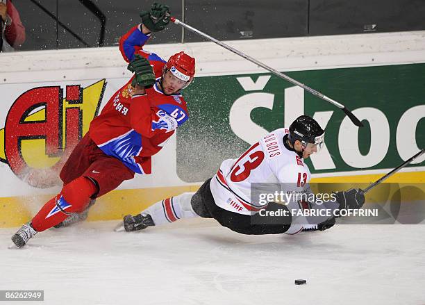 Russia's Alexander Radulov collides with Switzerland's Felicien du Bois during their Group B preliminary round game, at the 2009 IIHF Ice Hockey...