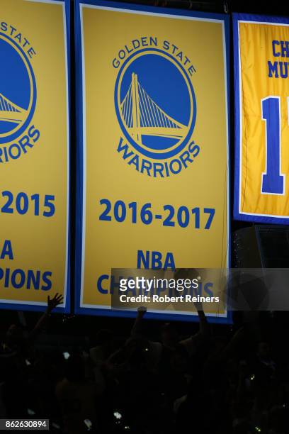 The Golden State Warriors display their 2017 NBA Championship banner prior to their NBA game against the Houston Rockets at ORACLE Arena on October...