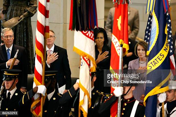 Senate minority leader Mitch McConnell , Senate Majority Leader Harry Reid , First Lady Michelle Obama and Speaker of the House Nancy Pelosi listen...