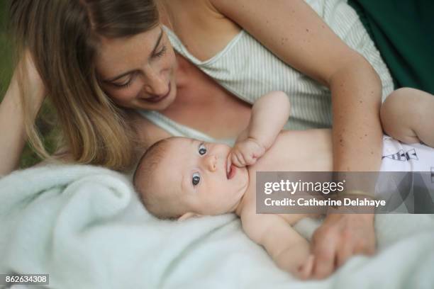 a 3 months old baby boy with his mum - baby blanket stock pictures, royalty-free photos & images