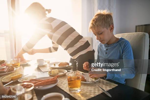 Family enjoying breakfast together on sunny morning