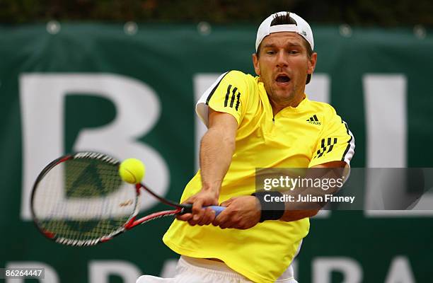 Jurgen Melzer of Austria plays a backhand in his match against Julien Benneteau of France during day two of the Foro Italico Tennis Masters on April...