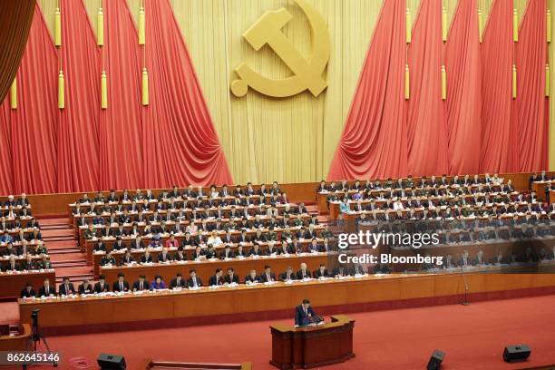 Xi Jinping, China's president, speaks at the podium during the opening of the 19th National Congress of the Communist Party of China at the Great...