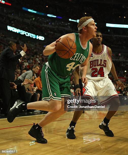 Brian Scalabrine of the Boston Celtics moves past Tyrus Thomas of the Chicago Bulls in Game Four of the Eastern Conference Quarterfinals during the...