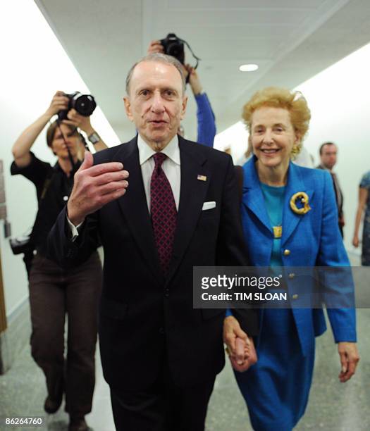 Senator Arlen Specter walks with his wife Joan April 28, 2009 to a Senate Appropriations Committee emergency hearing on the Swine Influenza on...