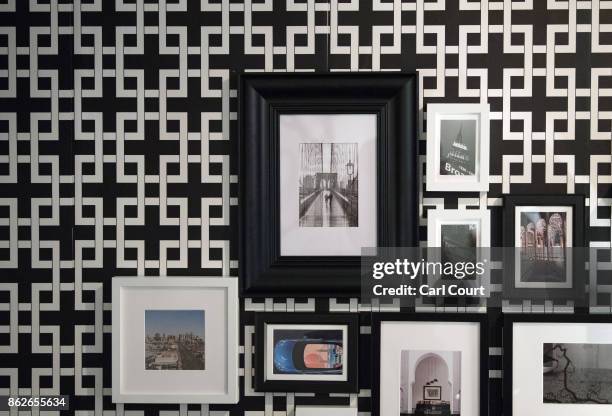 Pictures are displayed in the 'Noughties Room' of the IKEA house on October 17, 2017 in London, England. The room is in the 'IKEA House Party' which...