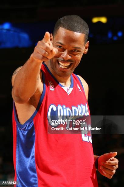 Marcus Camby of the Los Angeles Clippers points as he looks on with a smile during the game against the New York Knicks at Madison Square Garden on...