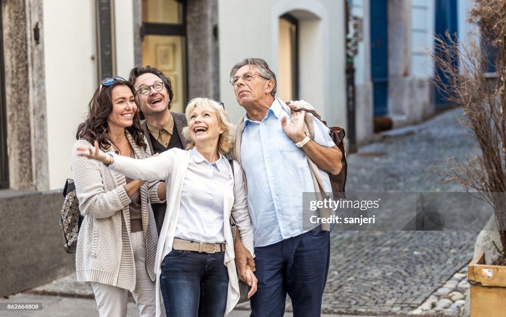 Mature Couples Looking Around Old Town
