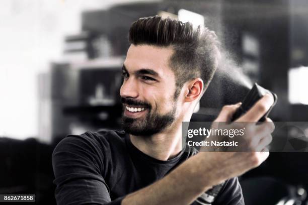 fashion guy using hairspray - men hair stock pictures, royalty-free photos & images