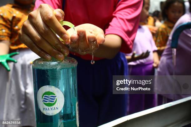 Students practice handwashing with soap properly, in commemoration of Global Handwashing Day commemorated every October 15, at 15th State Elementary...