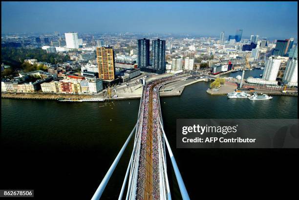 Participants of the 23 edition of the Rotterdam marathon pass the Erasmus bridge, 13 April 2003, the Netherlands. Kenyan William Kiplagat won the...