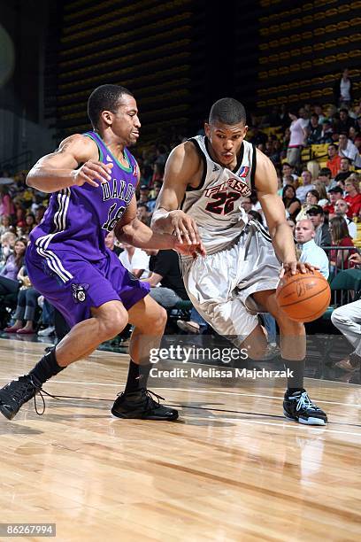 Morris Almond of the Utah Flash drives to the basket against David Bell of the Dakota Wizards during the second round of the D-League Playoffs on...