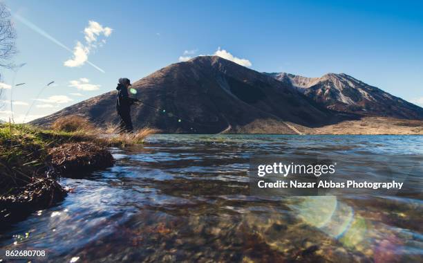 freshwater fishing at lake pearson, south island, new zealand. - freshwater fishing stock pictures, royalty-free photos & images