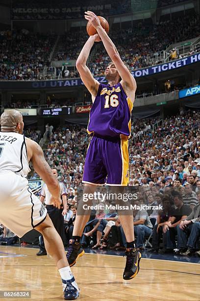 Pau Gasol of the Los Angeles Lakers shoots the ball over Carlos Boozer of the Utah Jazz in Game Three of the Western Conference Quarterfinals during...