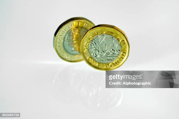 new pound coins - balance finance minimal stock pictures, royalty-free photos & images