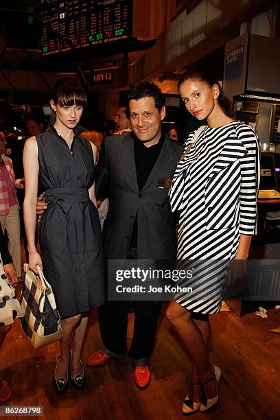 Designer Isaac Mizrahi poses for photo with models at the NYSE Closing Bell ringing and a fashion show to celebrate Isaac Mizrahi's collection for...