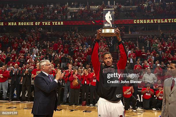 Playoffs: NBA commissioner David Stern with Rookie of the Year Chicago Bulls Derrick Rose holding Eddie Gottlieb Trophy before game vs Boston...