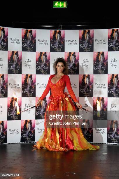 Katie Price poses at a photocall for her new novel 'Playing With Fire' at The Worx Studio's on October 17, 2017 in London, England.