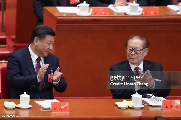 Chinese President Xi Jinping with China's former president Jiang Zemin at the opening session of the Chinese Communist Party's Congress at the Great...