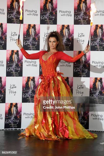 Katie Price poses at a photocall for her new novel 'Playing With Fire' at The Worx Studio's on October 17, 2017 in London, England.