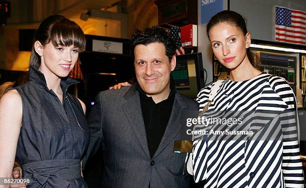 Designer Isaac Mizrahi with models wearing his collection for Liz Claiborne attend the NYSE Closing Bell ringing and a fashion show to celebrate...
