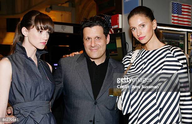 Designer Isaac Mizrahi with models wearing his collection for Liz Claiborne attend the NYSE Closing Bell ringing and a fashion show to celebrate...