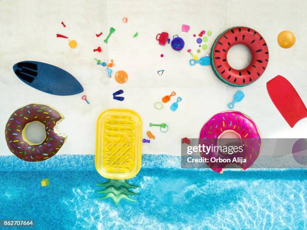 aerial view of toys in the pool - inflatable pool toys imagens e fotografias de stock