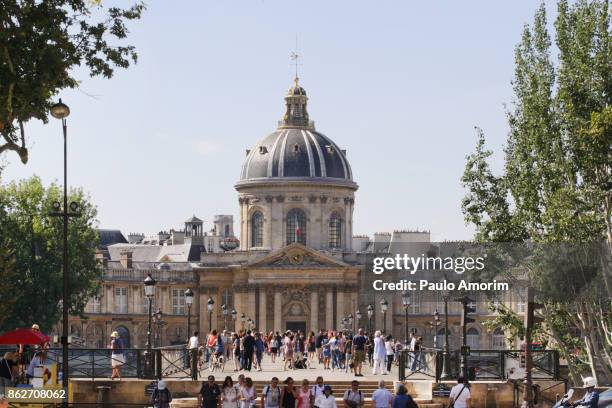 people enjoying at pont de arts in paris - saint germain stock pictures, royalty-free photos & images