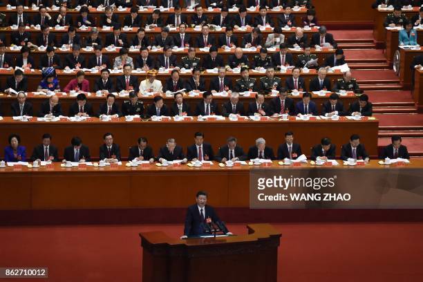 China's President Xi Jinping gives a speech at the opening session of the Chinese Communist Party's five-yearly Congress at the Great Hall of the...