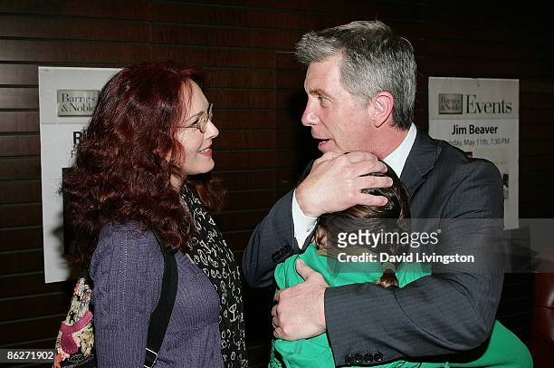 Host/author Tom Bergeron greets actress Amy Yasbeck and her daughter Stella Ritter at a signing for Bergeron's book "I'm Hosting as Fast as I Can!"...