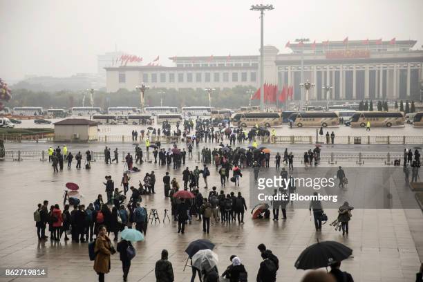 People walk outside the Great Hall of the People after the opening ceremony of the 19th National Congress of the Communist Party of China in Beijing,...