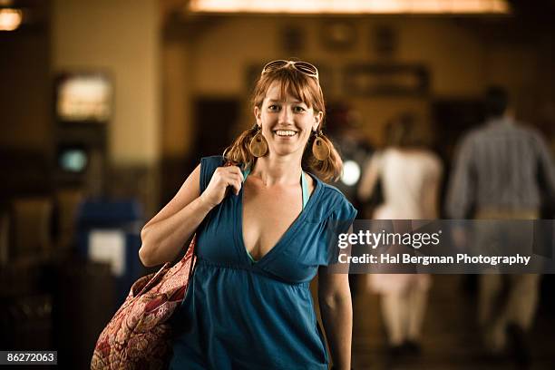 woman walking through union station - union station los angeles stock pictures, royalty-free photos & images