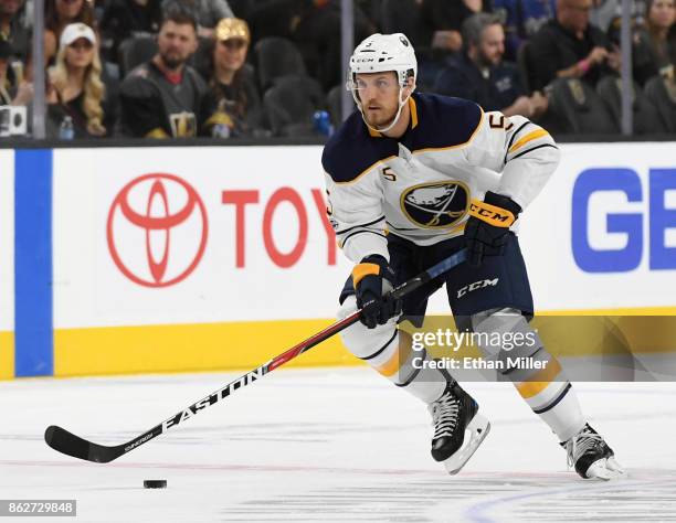 Matt Tennyson of the Buffalo Sabres skates with the puck against the Vegas Golden Knights in the first period of their game at T-Mobile Arena on...