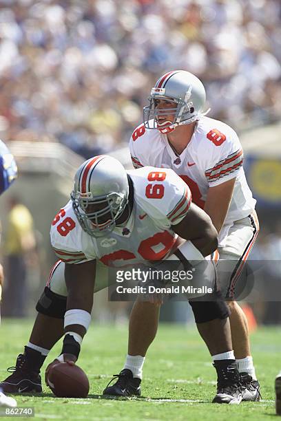 Quarterback Steve Bellisari of the Ohio State Buckeyes waits for the snap from center LeCharles Bentley against the UCLA Bruins during the game at...