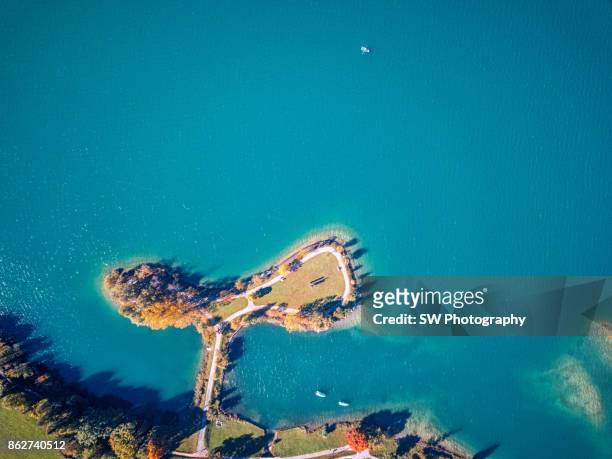 drone photo of a beautiful island located near lungern city, switzerland - lungern stock pictures, royalty-free photos & images