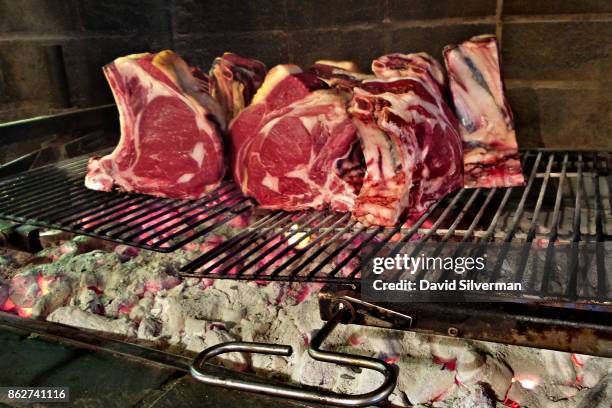 July 25: Bistecca alla Fiorentina, the iconic T-Bone steak from the city of Florence and a favorite of Tuscan cuisine, is prepared on a charcoal...