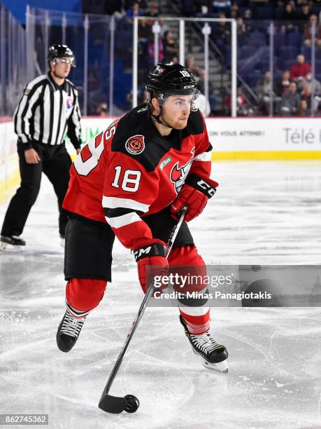 Blake Speers of the Binghamton Devils skates the puck against the Laval Rocket during the AHL game at Place Bell on October 13, 2017 in Laval,...