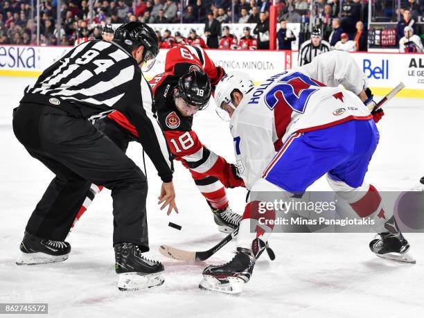 Blake Speers of the Binghamton Devils and Peter Holland of the Laval Rocket face-off during the AHL game at Place Bell on October 13, 2017 in Laval,...