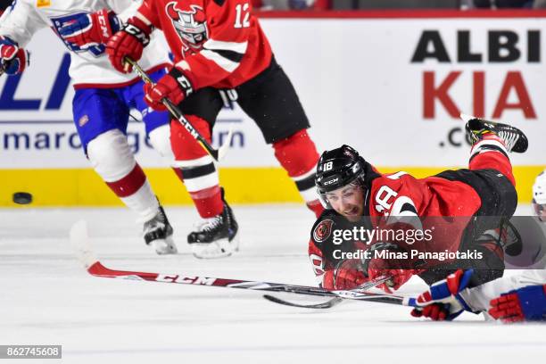 Blake Speers of the Binghamton Devils dives for the puck against the Laval Rocket during the AHL game at Place Bell on October 13, 2017 in Laval,...