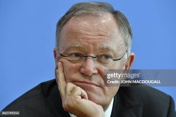 Lower Saxony's State Premier Stephan Weil, winner of regional elections in his northwestern federal state, addresses a press conference in Berlin, on...