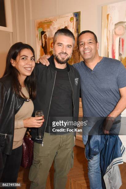 Raquel Dupray, Anthony Dupray and comedian Cartouche attend the 'Love EtcÉ' Caroline Faindt Exhibition Preview at '28 Octobre Office' on October 17,...