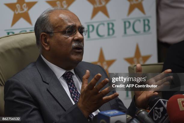 Chairman of Pakistan Cricket Board Najam Sethi gestures as he addresses a news conference at the National Stadium in Karachi on October 18, 2017. Sri...