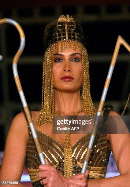 Model displays an outfit reminiscent of an ancient Egyptian queen during a fashion show at the 'Regional Countries General Trade Fair' in the...