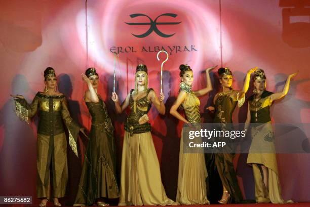 Models display outfits by a Turkish designer reminiscent of ancient Egypt during a fashion show at the 'Regional Countries General Trade Fair' in the...