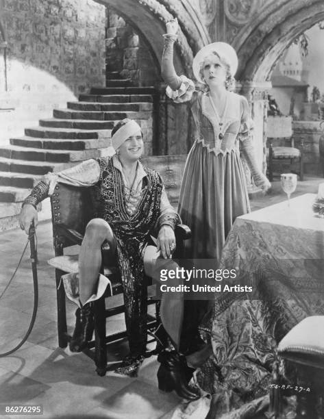 American actress Mary Pickford as Katherine, and Douglas Fairbanks as Petruchio, in a publicity still for 'The Taming Of The Shrew', directed by Sam...