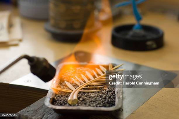 The Palme d'Or of the 62nd Cannes Film Festival is polished over a flame at the Chopard manufactory on April 28, 2009 in Geneva, Switzerland.