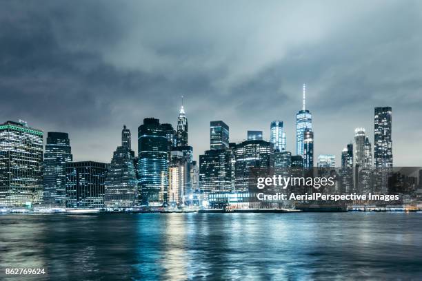 nightfall over manhattan financial district in new york, usa - new york city skyline night stock pictures, royalty-free photos & images