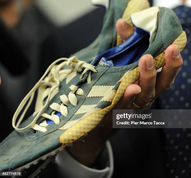 Pair of running shoes used by Pekka Vasala are displayed during the 'Divieto di sosta' book presentation on October 18, 2017 in Milan, Italy.